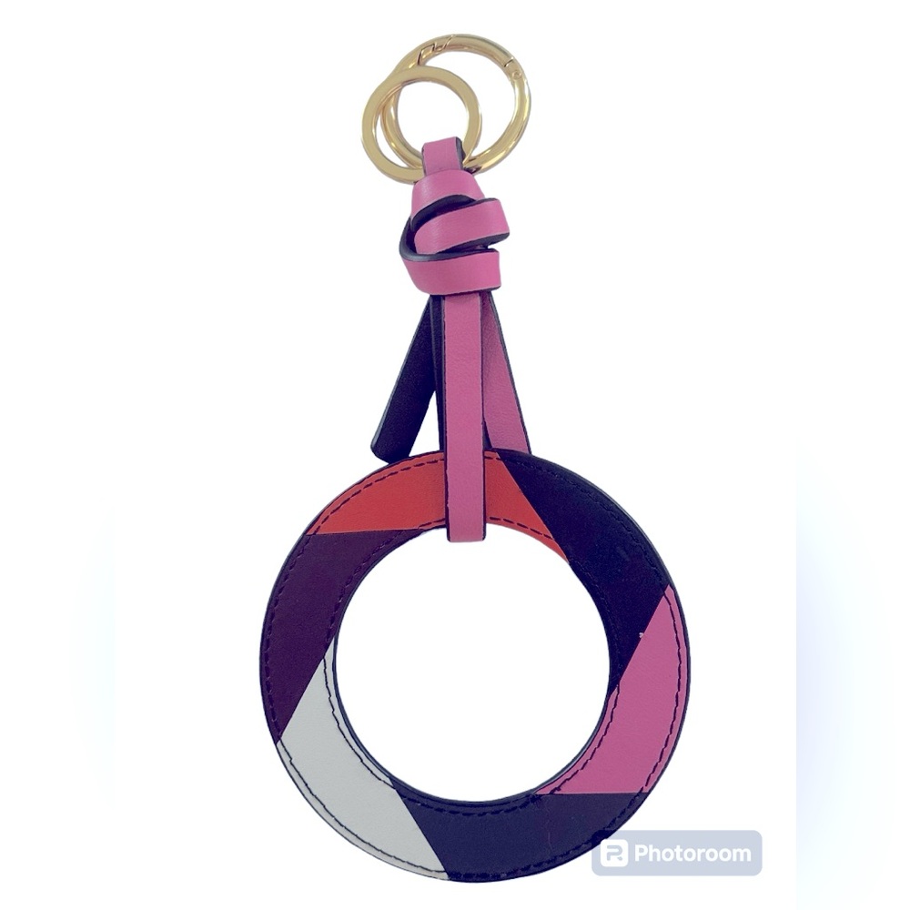 Bag leather charm in pink, white, brown, orange colors.